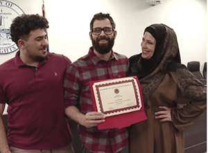 Ahmed Shraim surrounded by his family. – Videograb